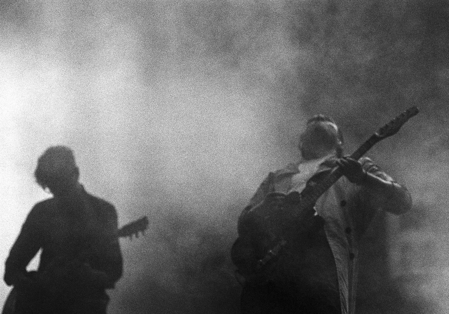 Band's guitarist shows passion inside the fog or smoke