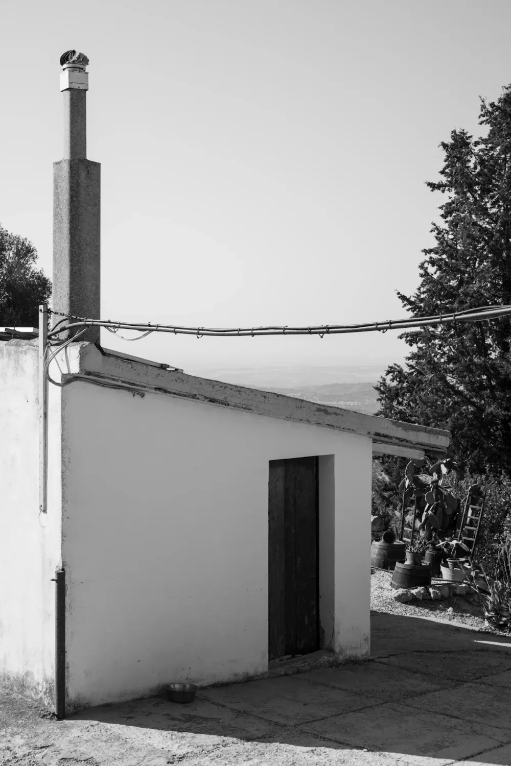 Part of a house on the mountain, pictured as minimal and portraying serene surroundings.