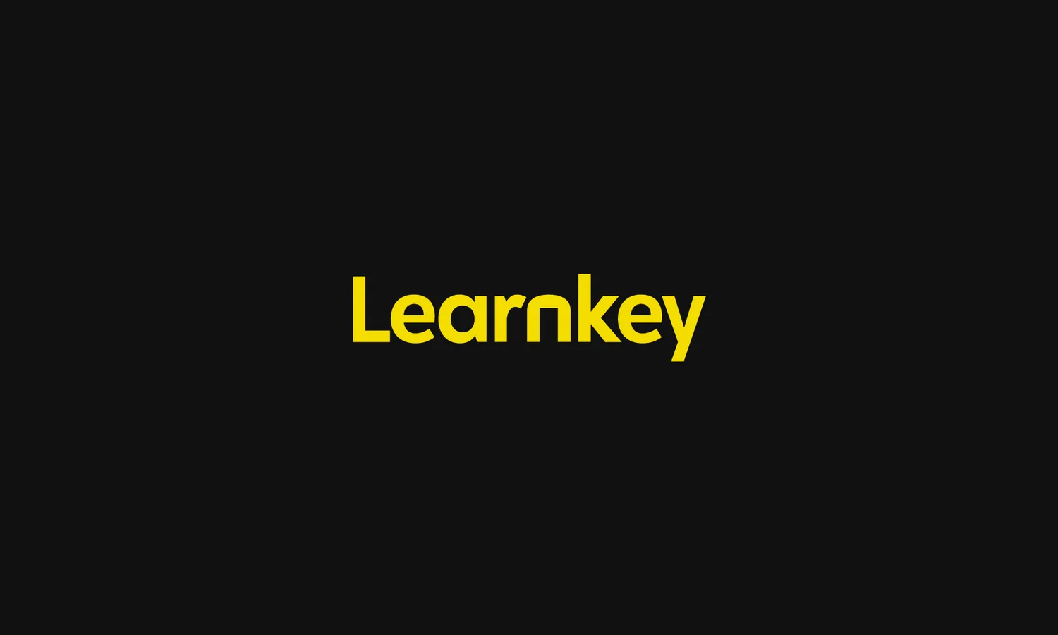 Yellow Learnkey logo on a black background